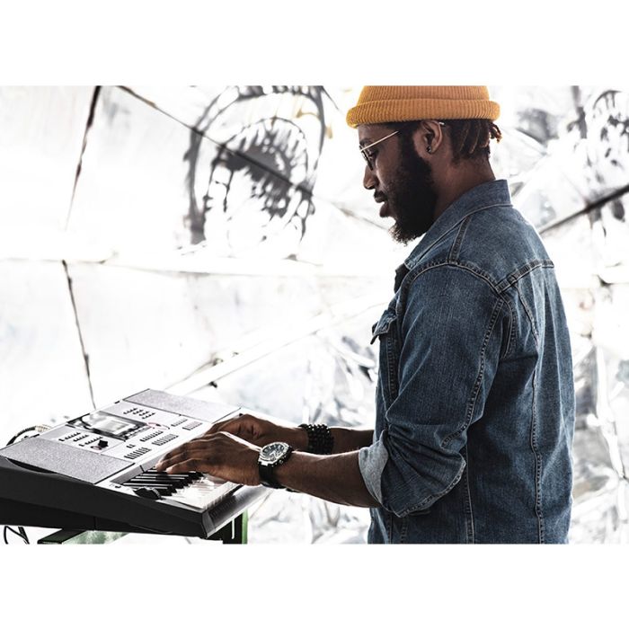 Men playing Casio CT-X3000 keyboard