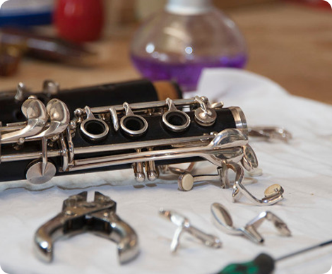 Clarinet part with repair tools on the table